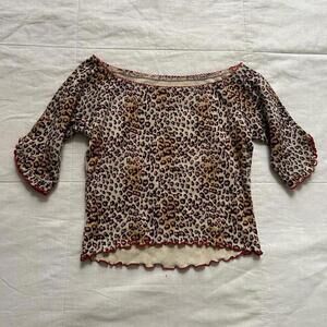 Jungle Cat leopard print shrunken fit baby tee with pink trim and lettuce hem